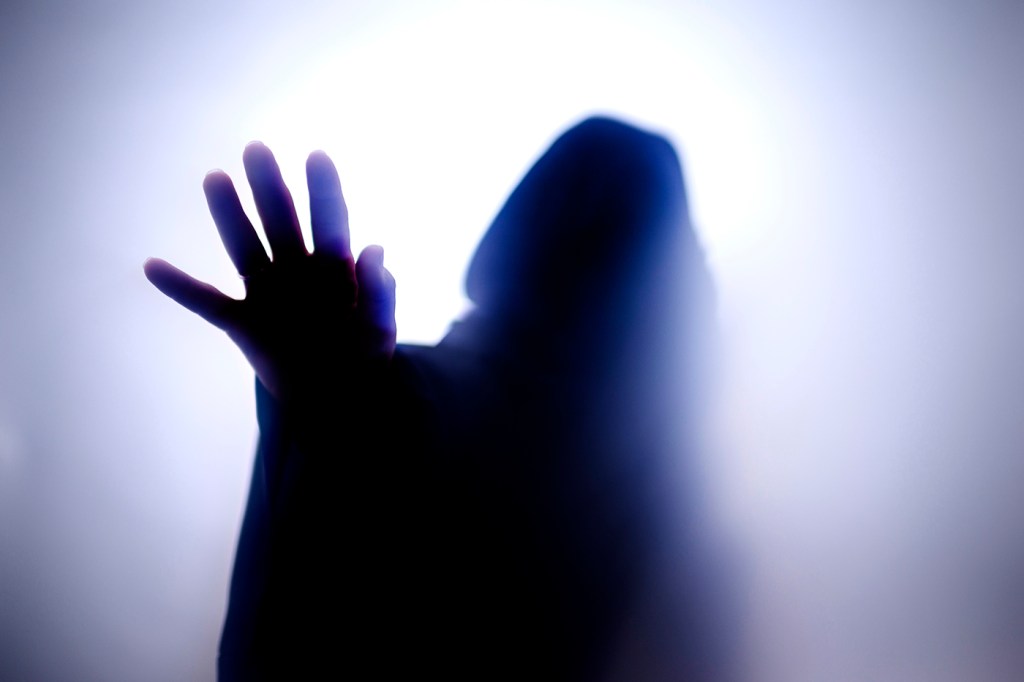 Silhouette of a ghost-like figure.
