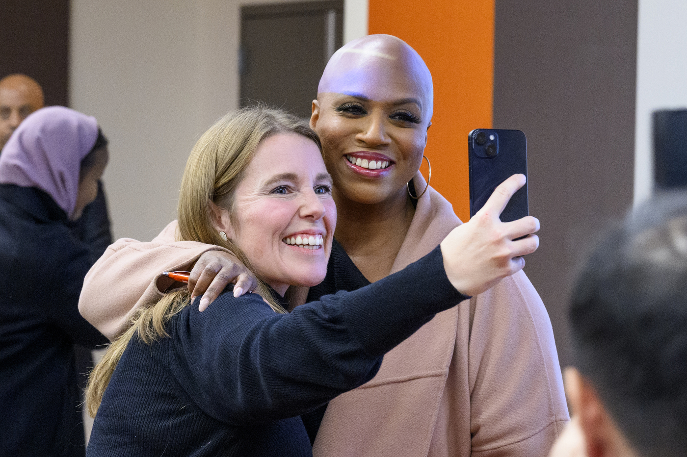 U.S. Rep. Ayanna Pressley posing for a selfie with someone else.