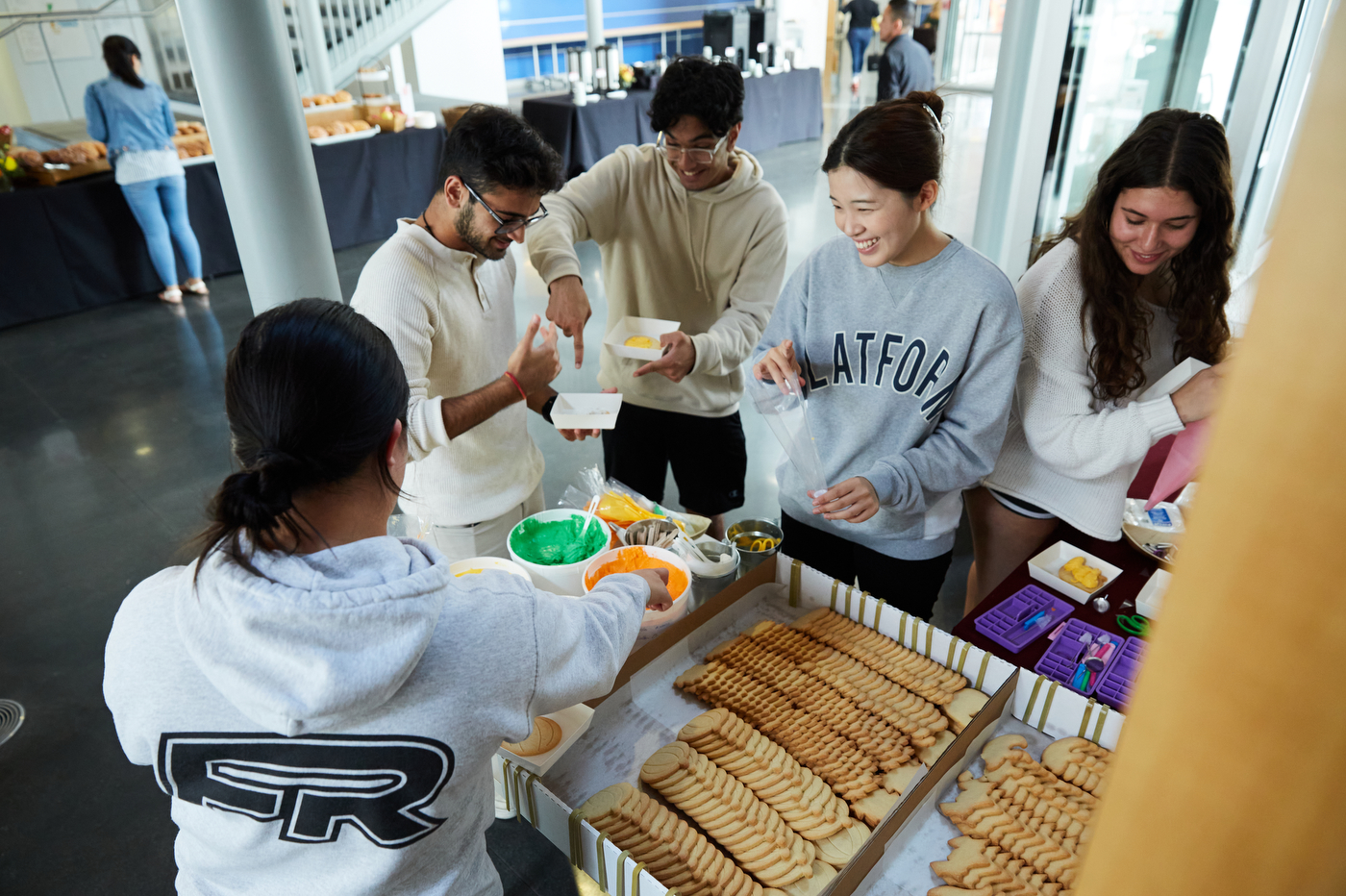 Students frosting cookies. 