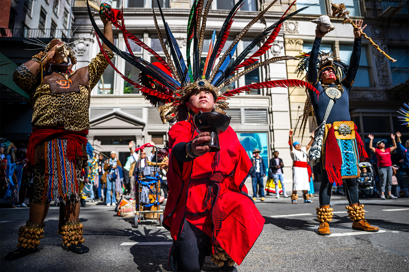 People participating in the Indigenous Peoples of the Americas parade.