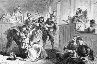 Black and white drawing of a Salem witch trial occurring.