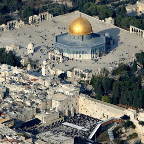 Aerial photo of worshippers gathered outside the Dome of the Rock Mosque.