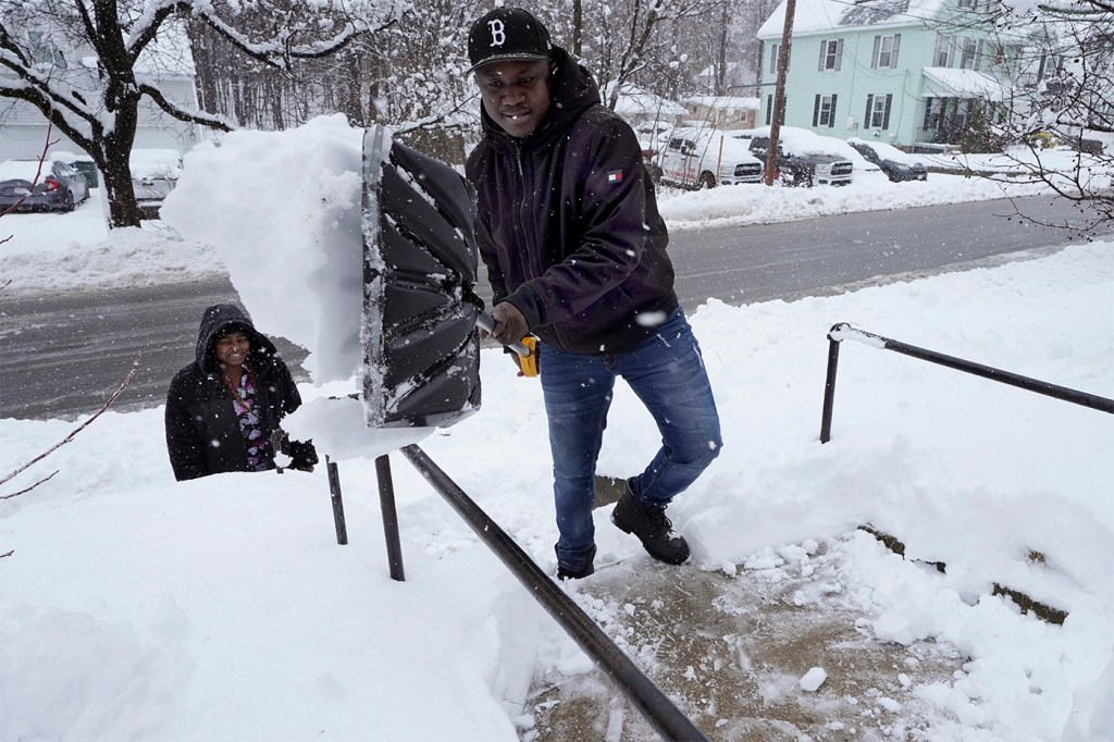 Berry Greg shoveling snow off his front steps.