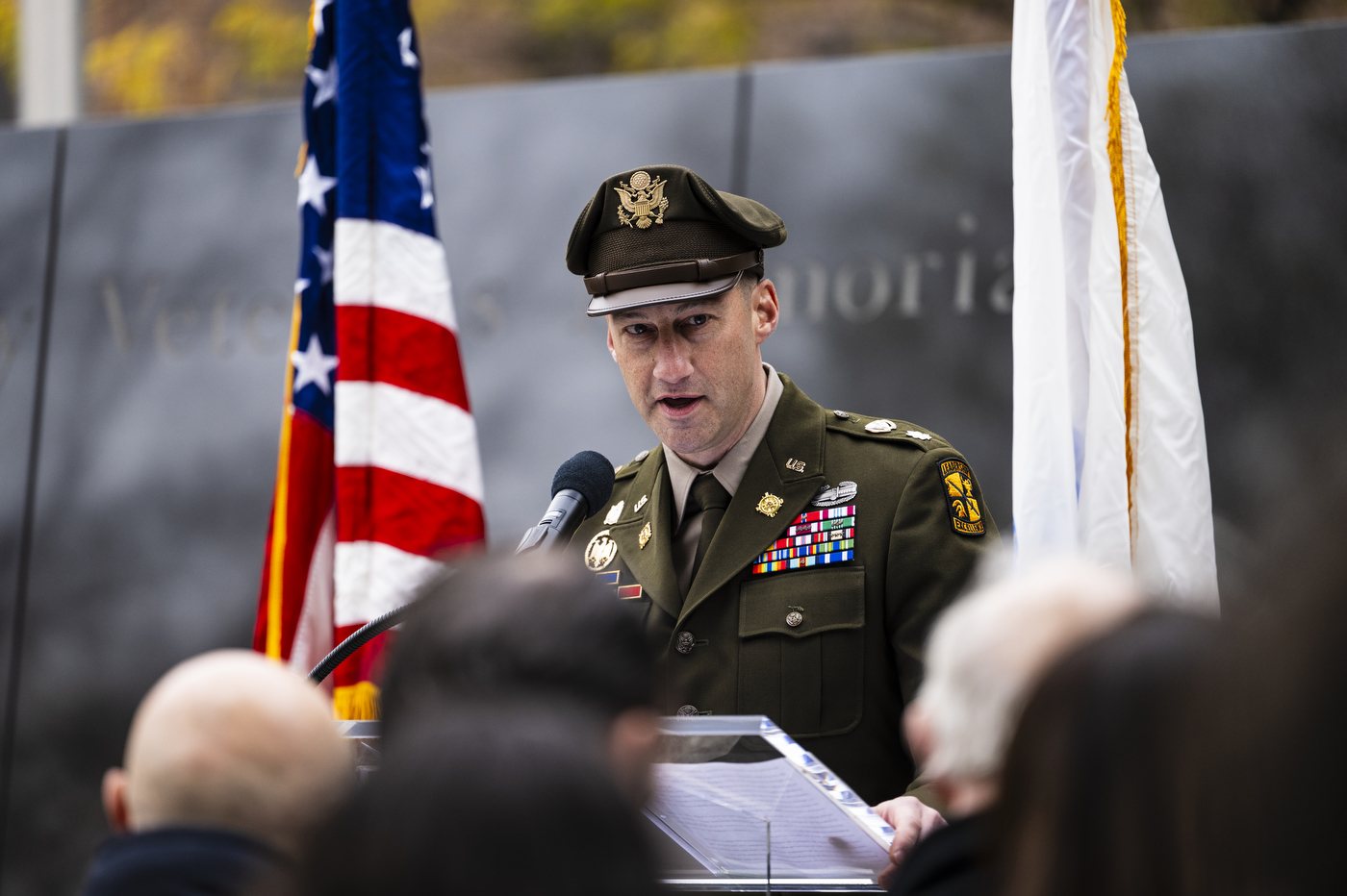 Military member in uniform speaking at the Northeastern Veterans Day Ceremony 2023.
