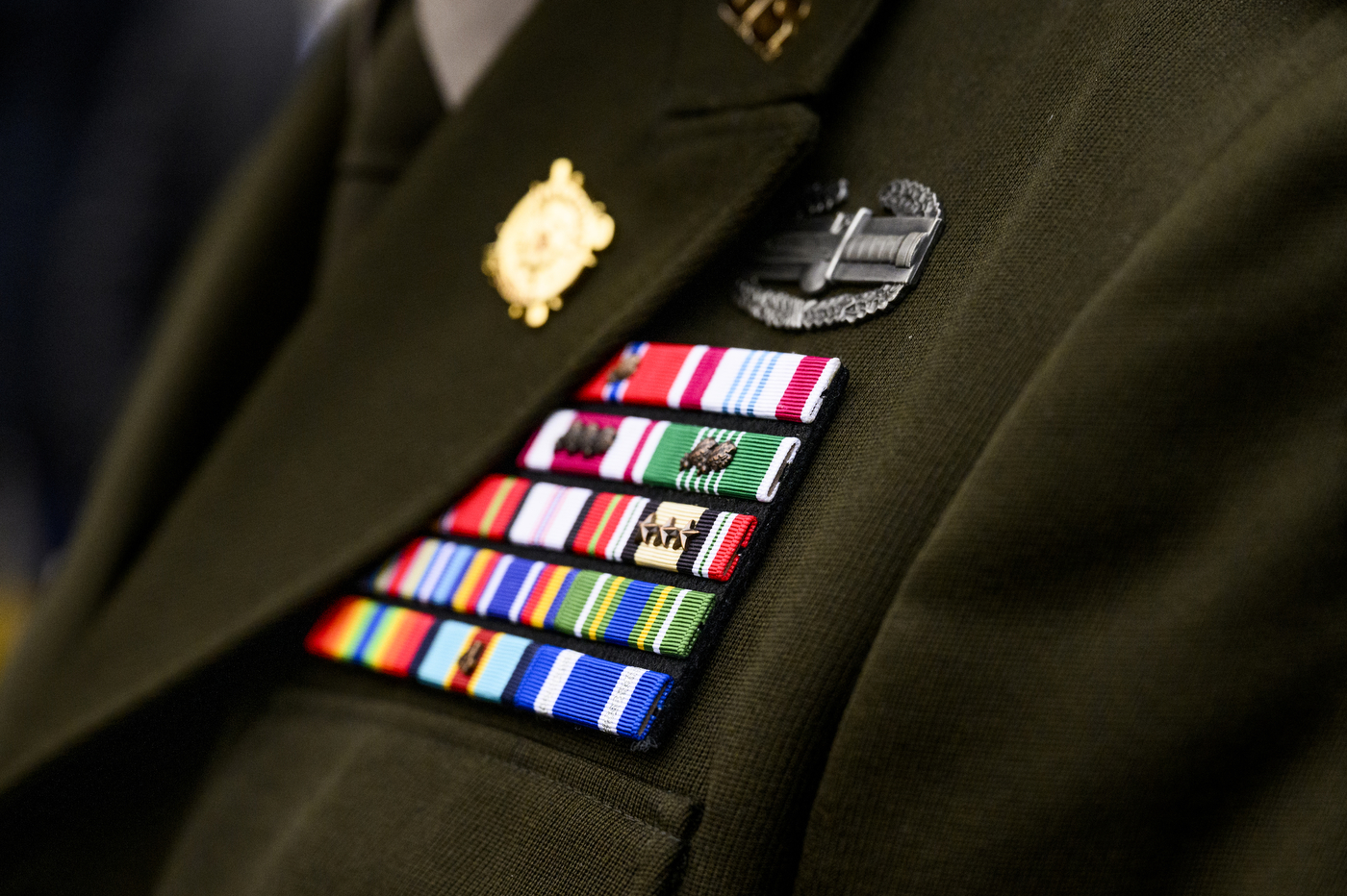 Badges on a person's military unifrom.