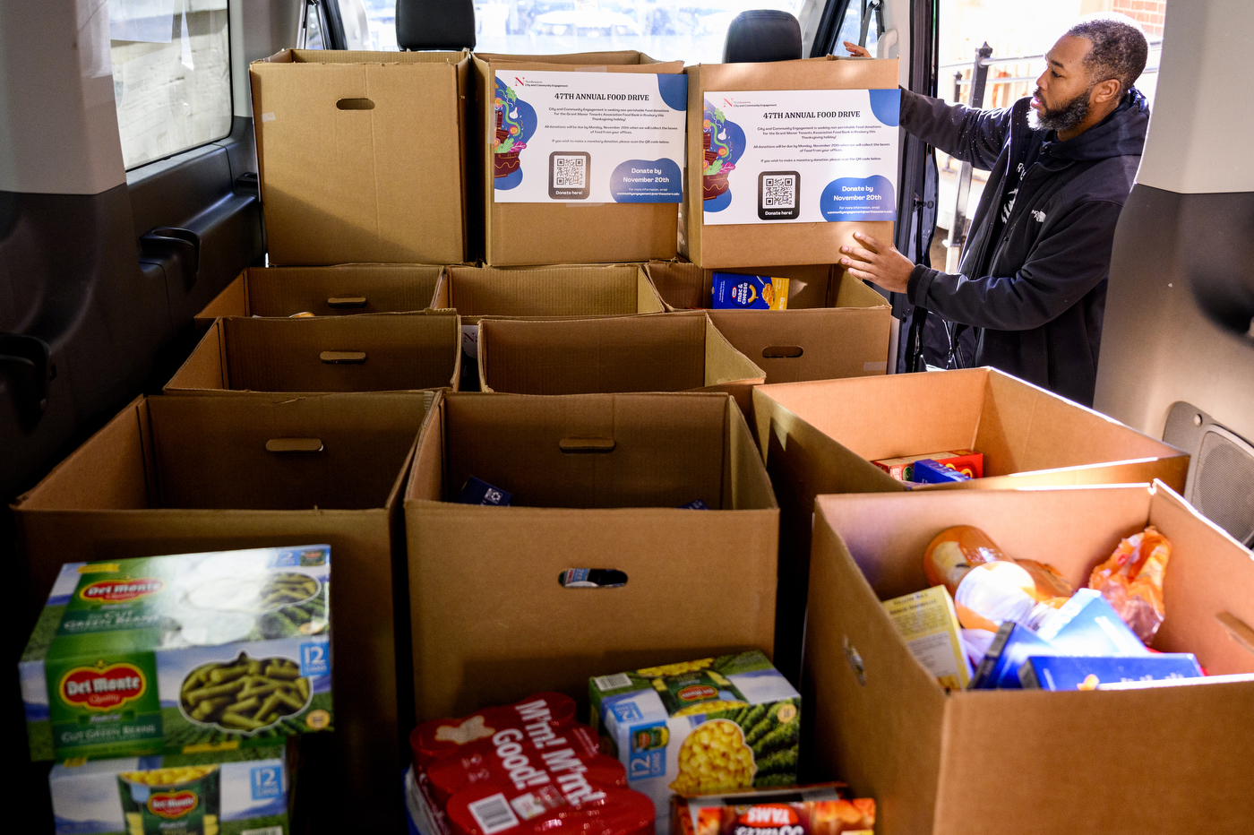 Truck loaded with boxes of food donations. 