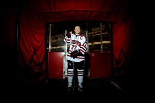 Kendall Coyne posing in her hockey gear