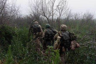 Troops in the Russia Ukraine War walking outside.