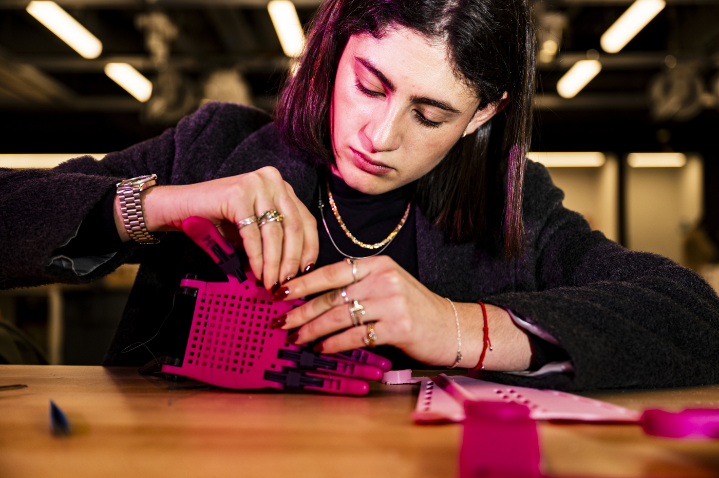 Isabella Castillo assembling a 3-D printed prosethetic hand.