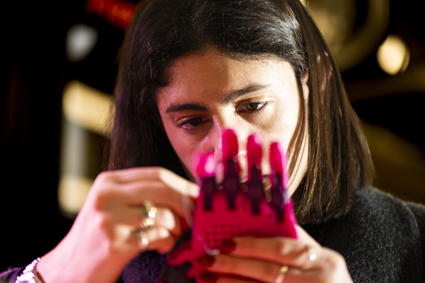 Isabella Castillo assembling a 3-D printed prosethetic hand.