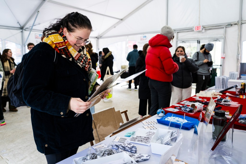 Member of the Northeastern community shopping at the holiday market.