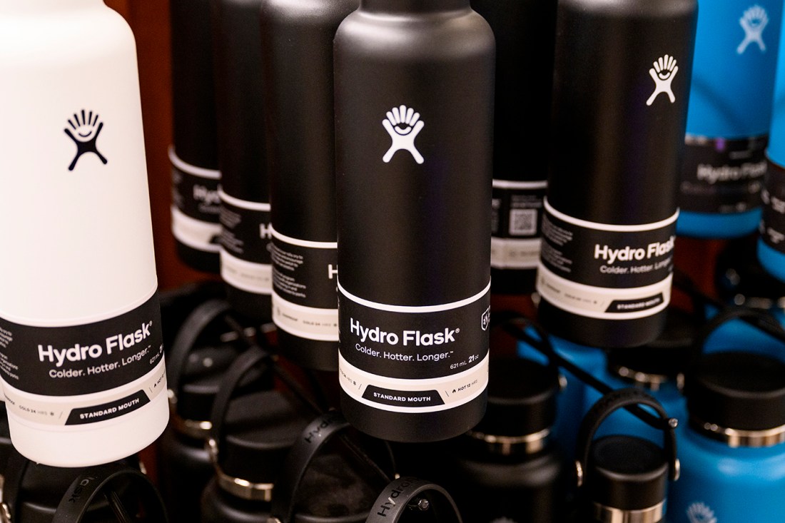 White, black, and blue Hydro Flask water bottles.