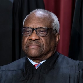 Clarence Thomas posing for a portrait at the Supreme Court building.