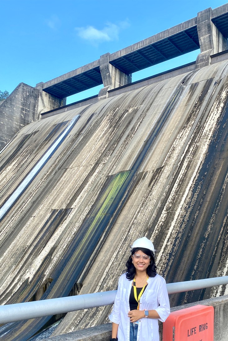 Puja Das posing in front of a Tennessee dam. 