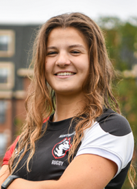Headshot of Alex Peterson outside in their Rugby uniform.