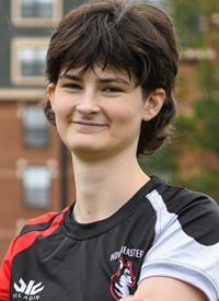 Headshot of Riley Chapman outside in their Rugby uniform.