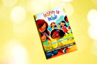 Front cover of 'Inspire to Include' on a yellow background.