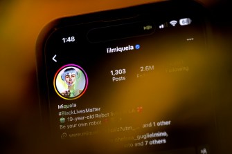 iPhone displaying the Instagram account of Miquela, an AI generated social media influencer.