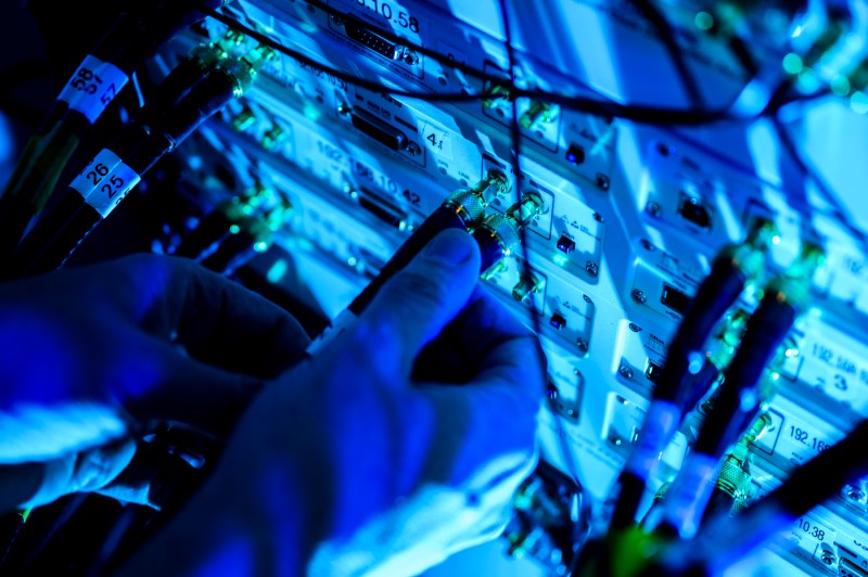 Tommaso Melodia touching the wires of a project inside ISEC.