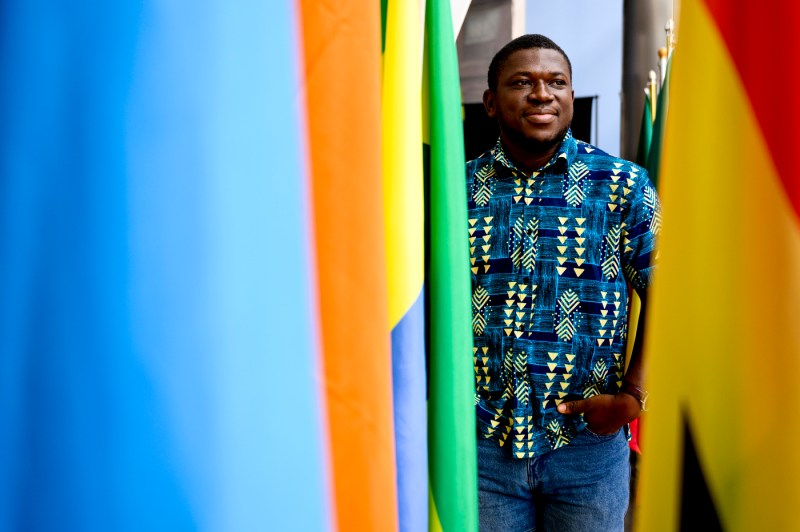 Moses Ayirebi posing for a headshot.