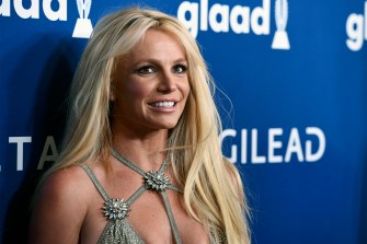 Britney Spears posing for photos at the GLAAD Media Awards in 2018.