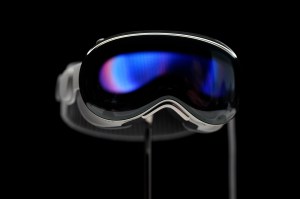 Apple VIsion Pro headset displayed in a dark showroom.