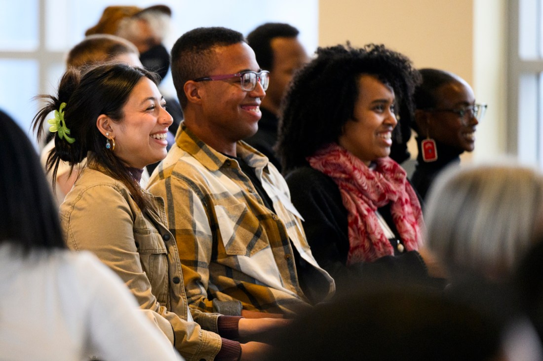 Audience members laugh during the annual bell hooks symposium.