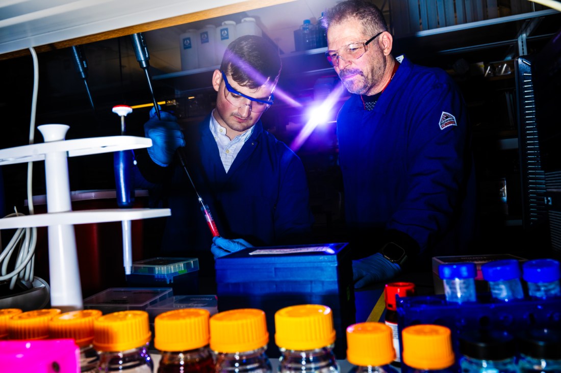 Jeffrey Ruberti and Jason Olszewski working in a lab in ISEC.