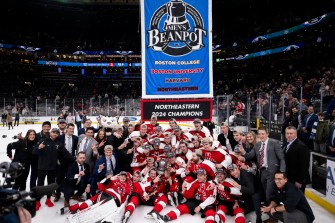 Northeastern men’s hockey team celebrate their win in the 2024 Beanpot tournament