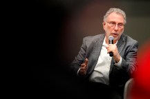 Marty Baron speaking into a microphone.