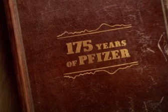 A brown book with golden-colored text: "175 years of Pfizer."