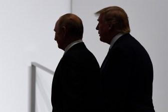 Silhouette of President Donald Trump and Russian President Vladimir Putin standing next to each other.