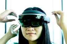 Woman wearing VR/AR goggles.