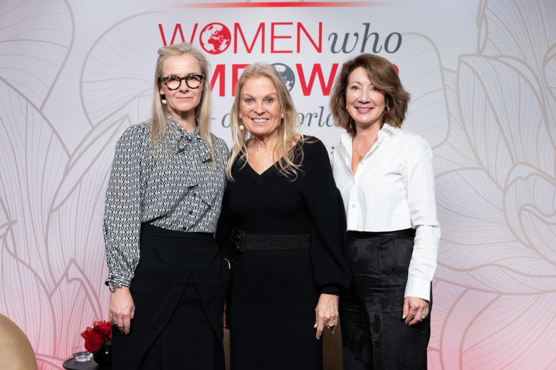 Jane D. Hartley posing with two other women at Women Who Empower event.
