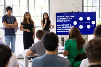 Students presenting at the Fintech Trek in Miami.