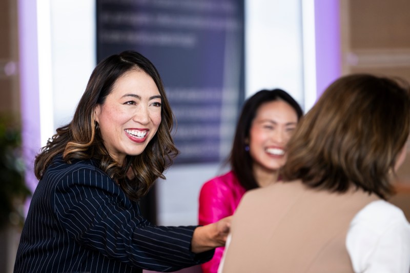 Elise Hu smiling at Women Who Empower event. 