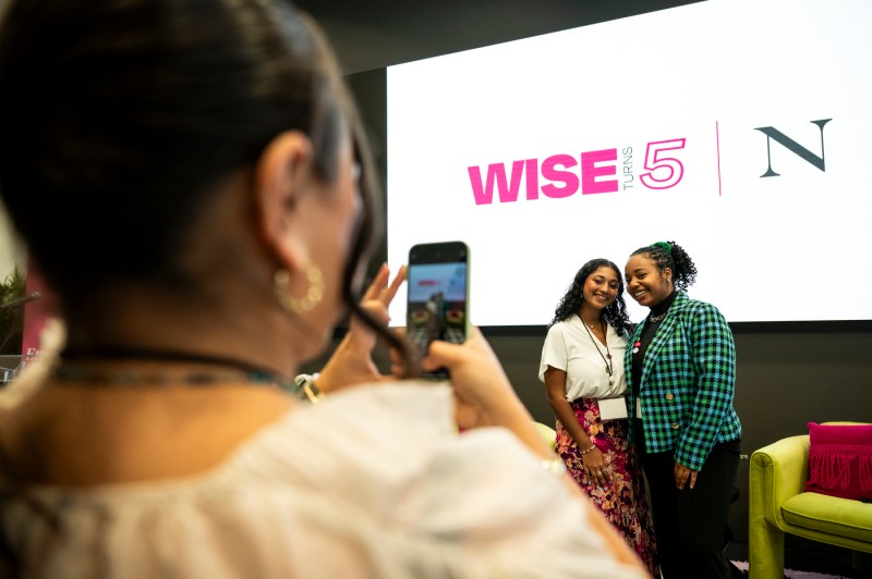 Two people posing for a photo at the WISE summit.
