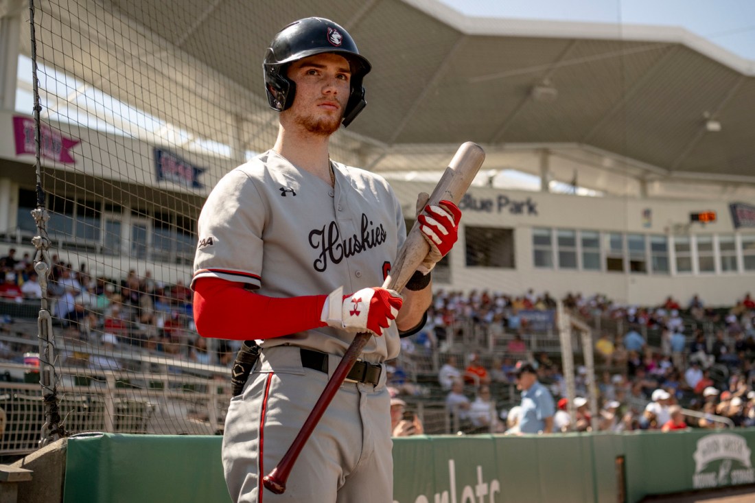 Mike Sirota holding a baseball bat at jetBlue Park in Fort Myers, Florida.
