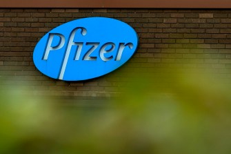 Pfizer logo on the outside of a Pfizer building.