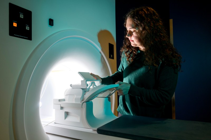Olivia Rowe, who is conducting research on treatment for stroke patients, works in an MRI lab.