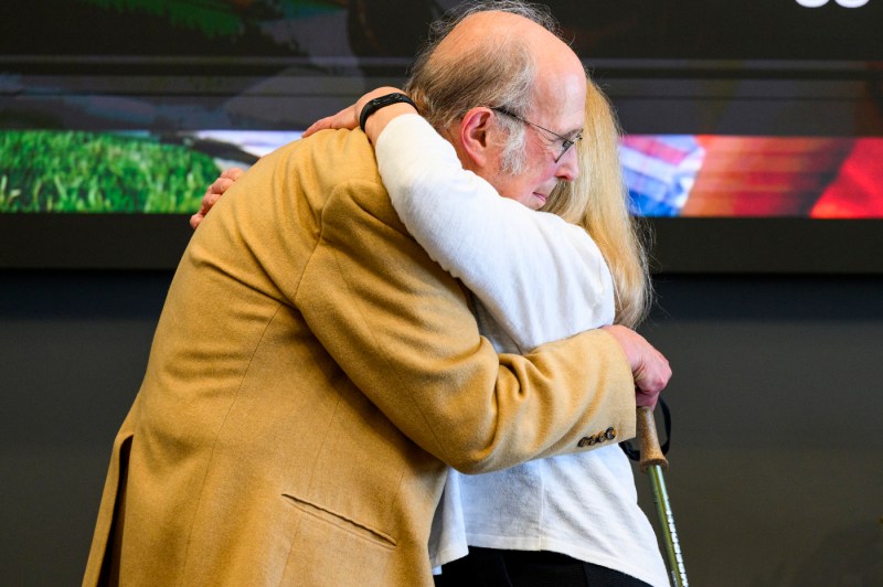 Michael B. Silevitch and Claire J. Duggan hugging at the rededication of the Center for STEM Education.