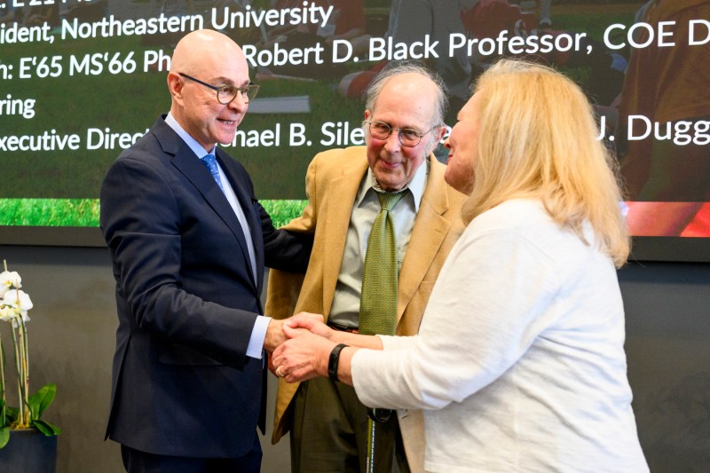 President Aoun shaking hands with Claire J. Duggan and Michael B. Silevitch.