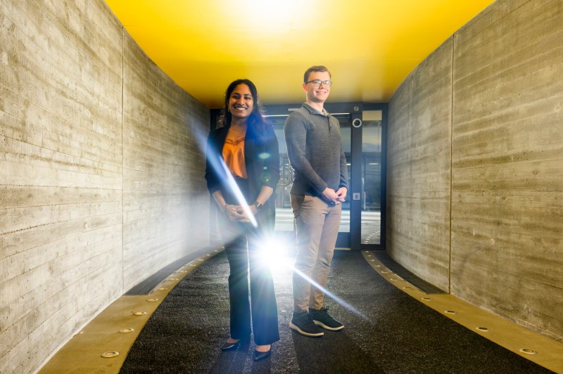 Luke Bagdonas and Kaitlyn Ramesh standing next to each other in the EXP tunnel posing for a photo.