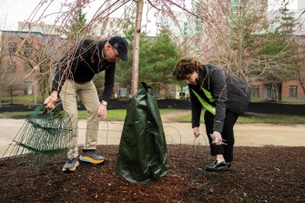 Cathleen and Thomas Griffin planting a tree.