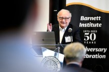 Barry L. Karger gesturing while speaking at the Barnett Insitute 50th Anniversary.