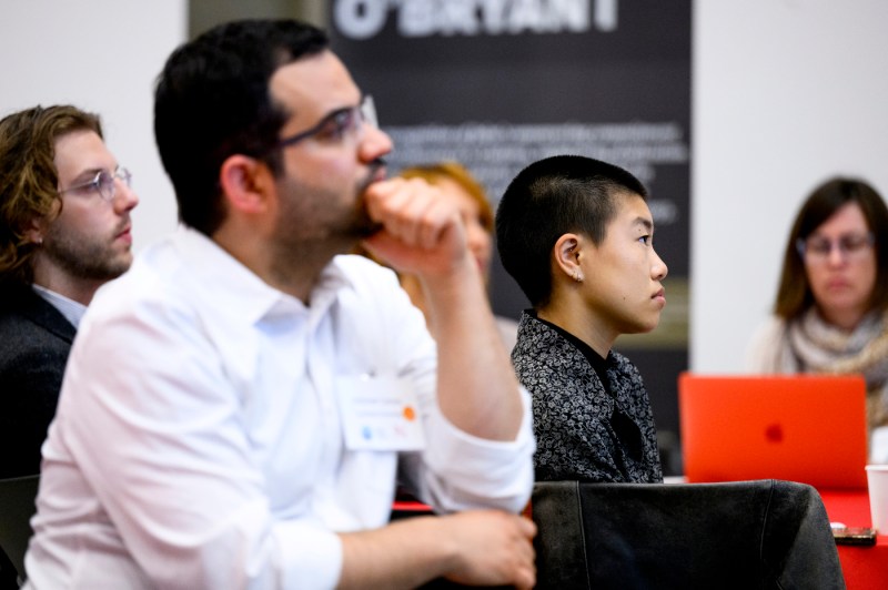 Audience members listening intently during the Algorithmic Workplace event.