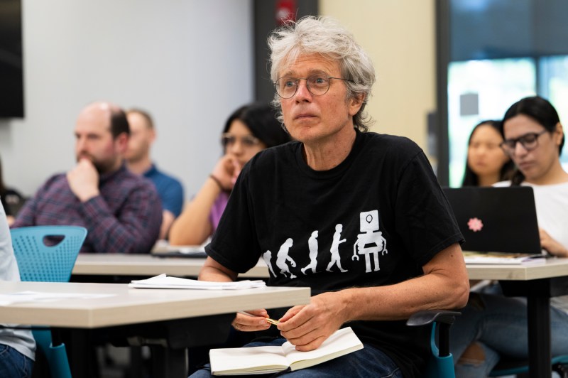 An audience member listening to Chris Wiggins.