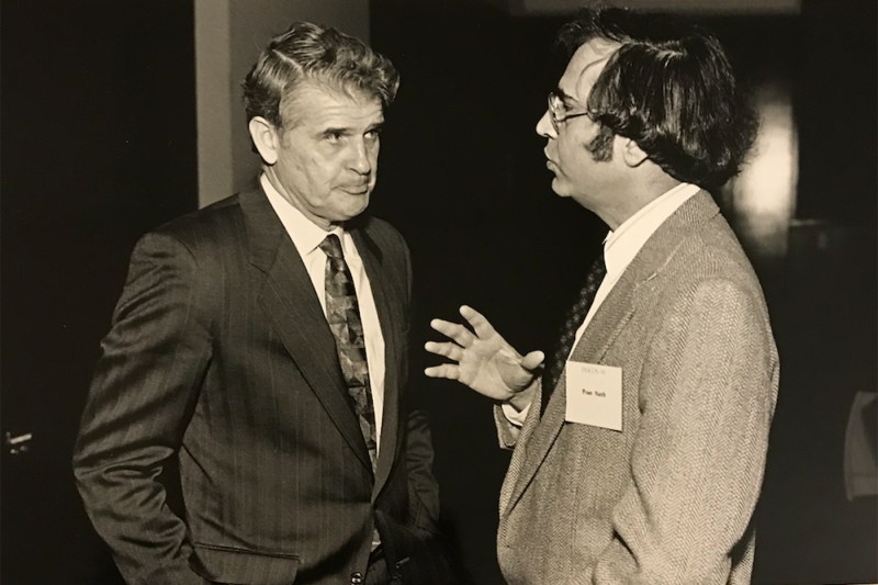 A black and white photo of Pran Nath and another professor.