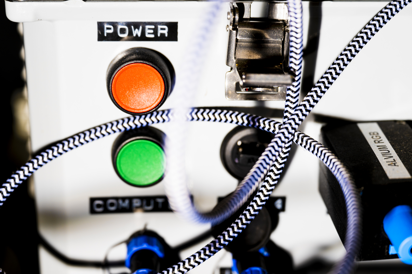 A label called "power" is placed above the red and green buttons on a robotic machine.

A label called "power" is placed above the red and green buttons on a robotic machine.