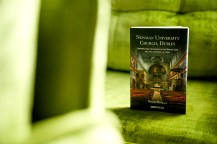 A book titled "Newman University Church Dublin" on a bright green chair.